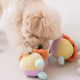 Dog playing with BITE ME Long-Lasting Nosework Clown Toy with treat pockets and squeaker